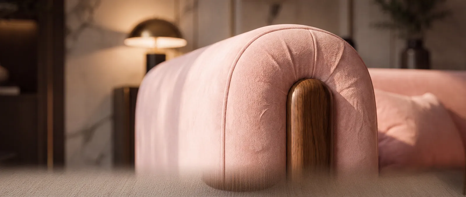 Close-up of Evara velvet upholstery and walnut detail